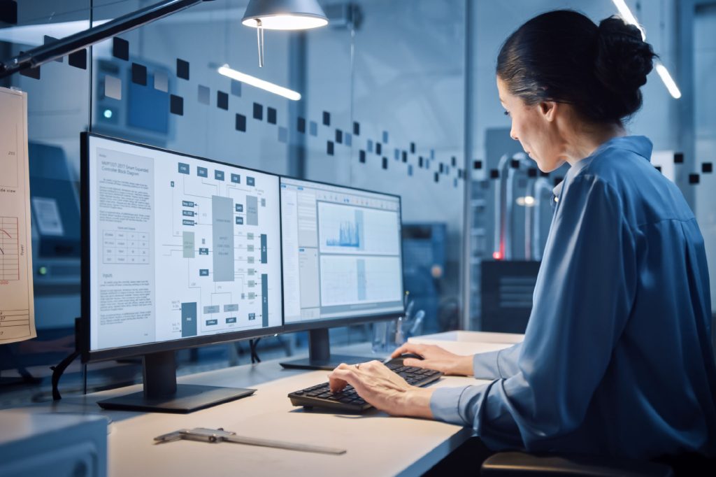 A professional working in a modern office or laboratory.