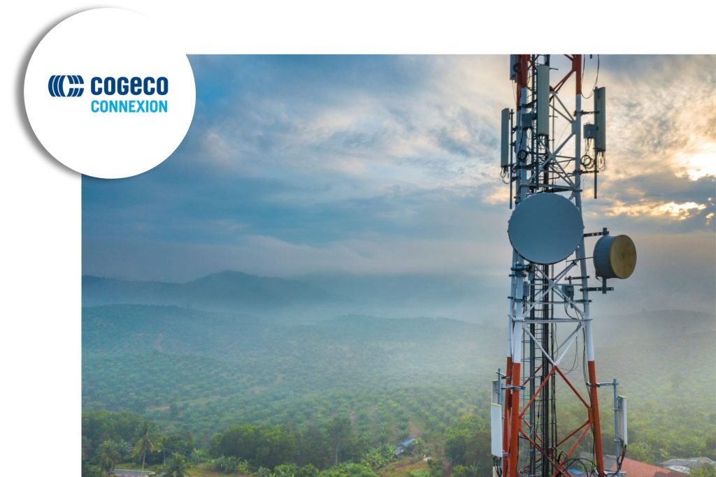 Telecommunications tower standing over a fog-covered landscape at sunrise, with the Cogeco Connexion logo in the corner.