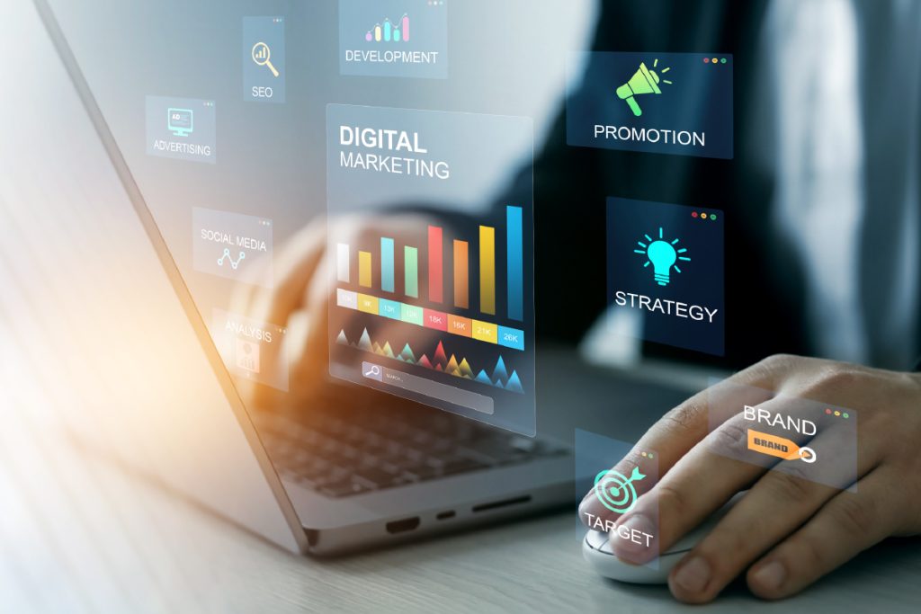 Person working on a laptop with digital marketing analytics and strategy icons.