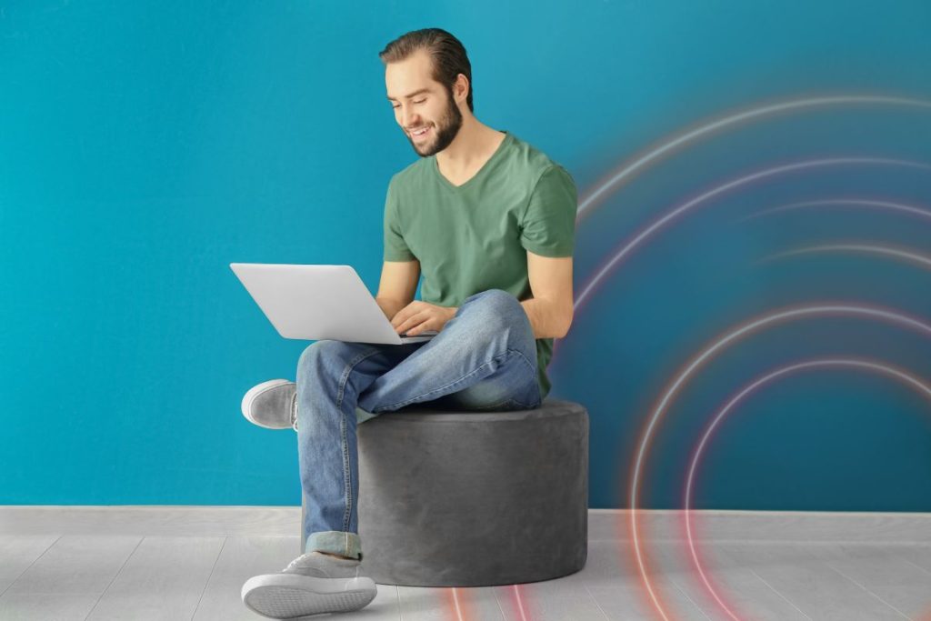 Professional working on a laptop, illustrating Certinia solutions that support modern, flexible professional services and financial management.