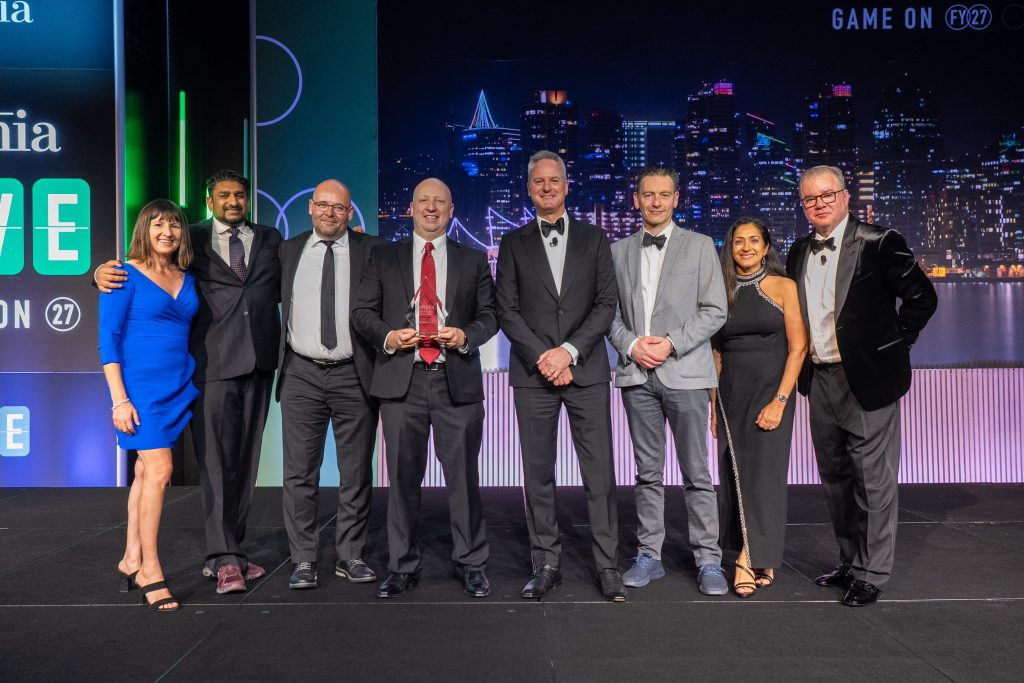 Diabsolut team members accepting the Certinia Partner of the Year 2025 award in San Diego.