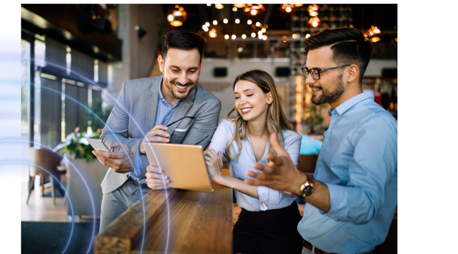 3 business professionals looking at a laptop