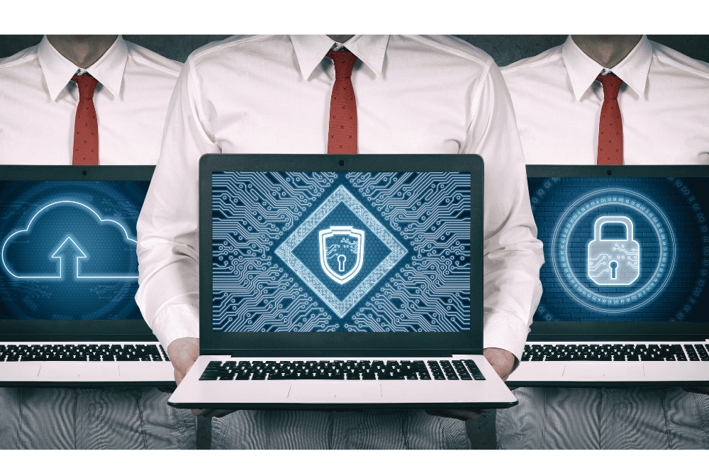 3 Cybersecurity professionals with secure cloud technology on laptops
